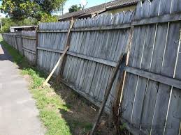 Before: damaged fence